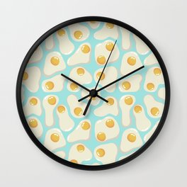 Fried Eggs on blue background Wall Clock
