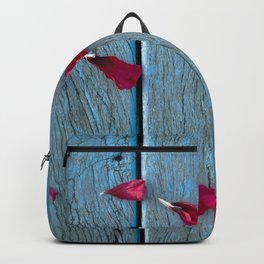 Rose red petals on a turquoise bench Backpack