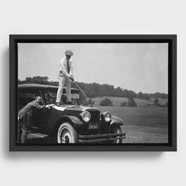 Pro golfer hitting golf ball off vintage car hood ornament on a dare par one 18th hole funny black and white golf sport photograph - photography - photographs Framed Canvas