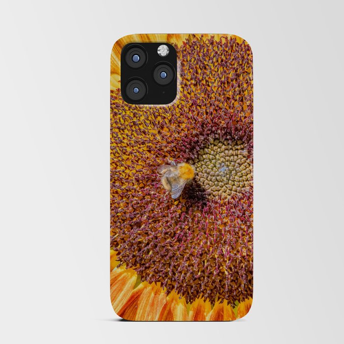 Close up view of a Sunflower bloom with a bee collecting pollen iPhone Card Case