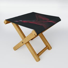 Goddess in the red dress stands in the dark Folding Stool