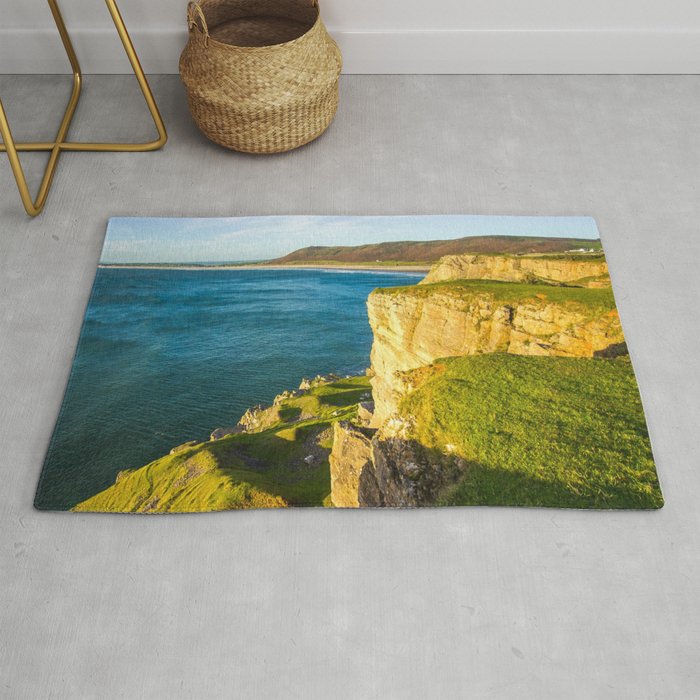 Great Britain Photography - Sunset Shining On A Cliff By The Blue Ocean Rug