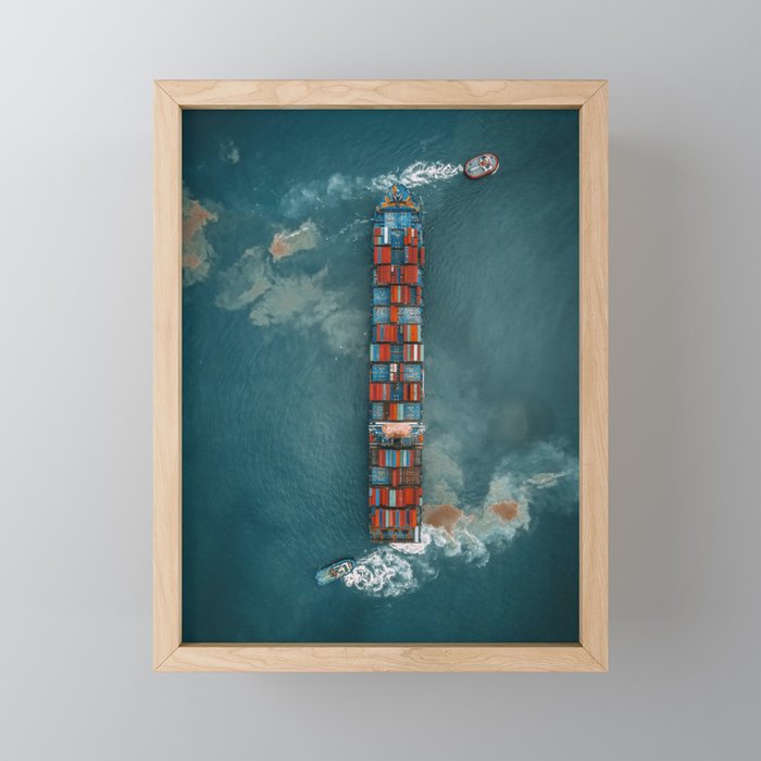 Aerial shot of cargo ship under road bridge Framed Mini Art Print