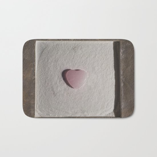 Rose Quartz heart in a zen garden Bath Mat