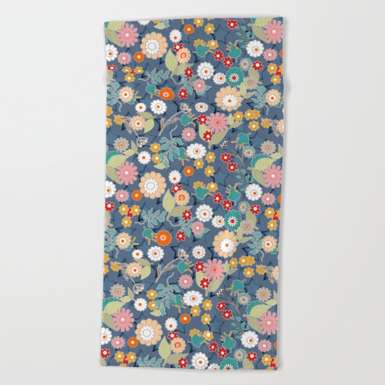 Colorful flowers on a denim background. Beach Towel