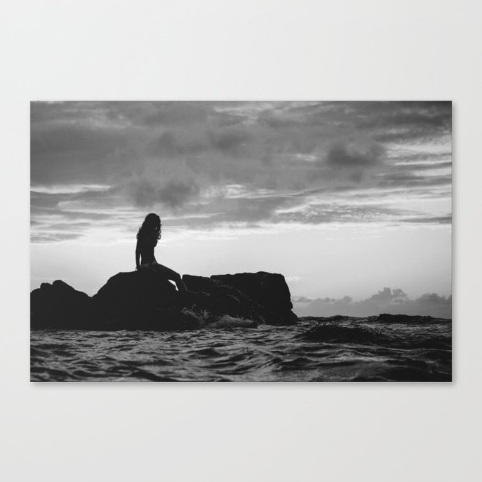 Down at sunset beach; female seaside staring longingly out to sea black and white photograph - photography - photographs Canvas Print