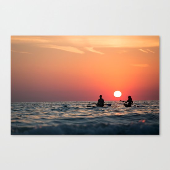 man woman boat rowing in sea Canvas Print